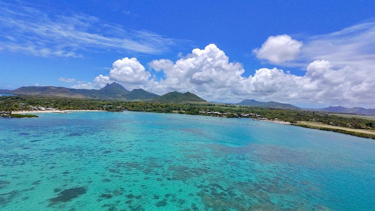 Aerial view of turquoise lagoon and coastal landscape in Mauritius