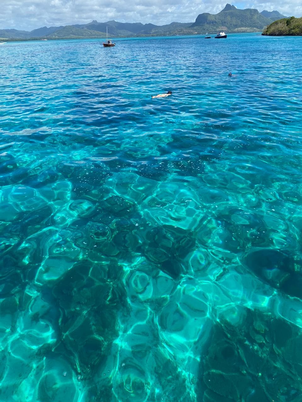 Turquoise ocean waves and tropical island paradise in Mauritius